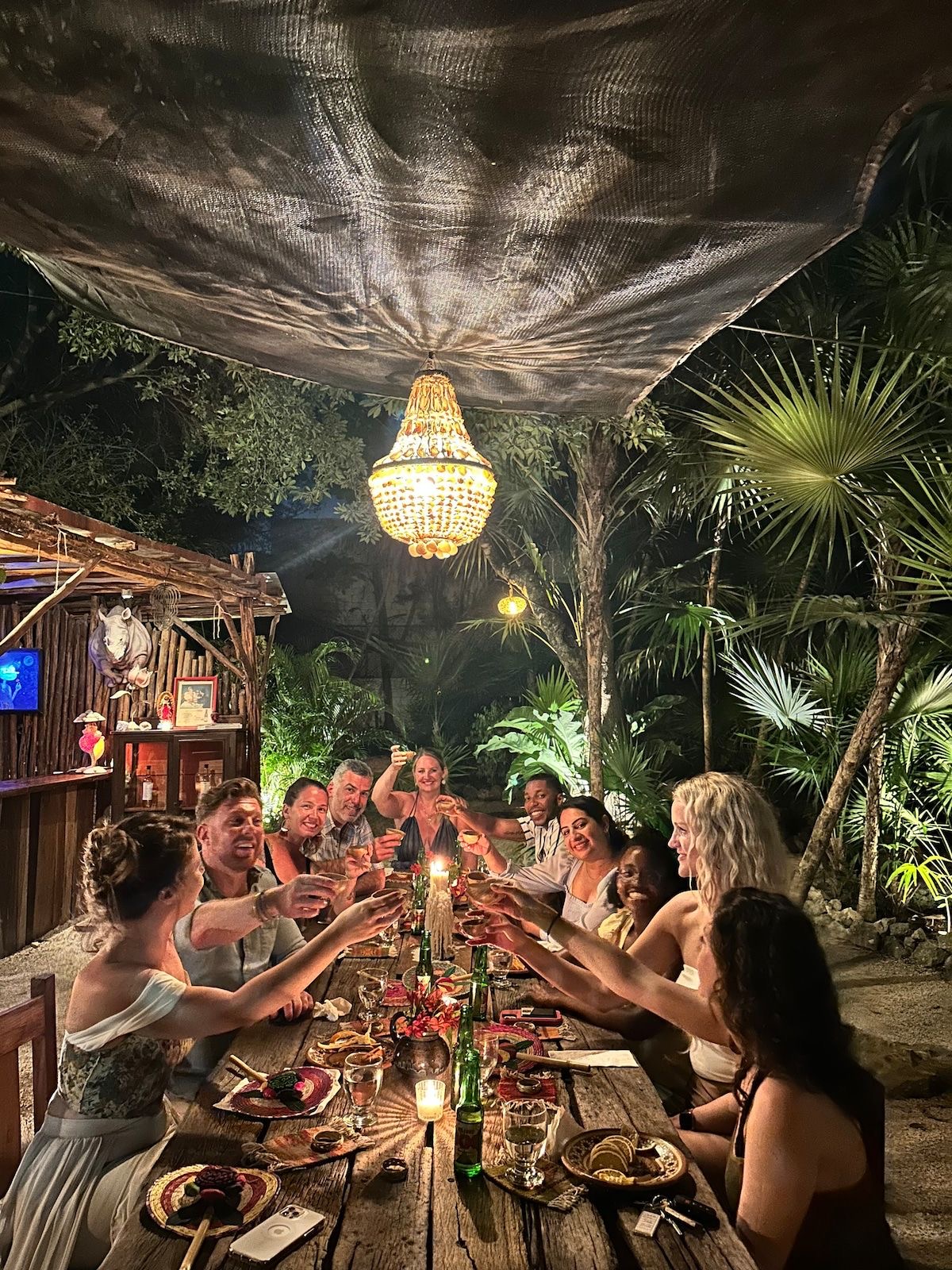 Founders laughing together around a table long after the plates have been cleared